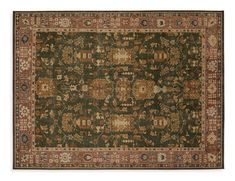 an antique rug with many different colors and patterns on the carpet, including red, green,