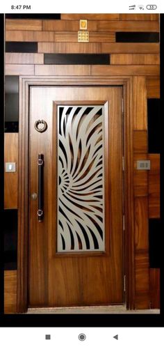 an image of a wooden door with metal designs on the front and side paneling