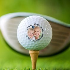 a golf ball sitting on top of a wooden tee