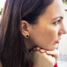 Crafted from 18-karat gold vermeil, this pair of stud earrings from our 'Luccichio' collection is carefully handmade in our workshop in Italy, set with two genuine bloody garnet cabochons. Understated and elegant, it will add a glittering detail to your everyday outfit so as it will do with your evening styles. Garnet helps us feel grounded and connected to the present moment. If you're lacking in energy, it could be energy blockages within the body keeping you from your natural state of joy and Single Yellow Gold Earring As Gift For Her, Plating Techniques, Earrings Outfit, The Present Moment, Present Moment, Cameo Ring, Italian Jewelry, Garnet Earrings, Online Earrings