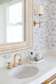 a bathroom sink with a mirror above it