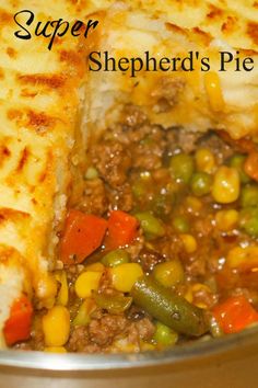 a close up of food in a pan with the words shepherd's pie on it