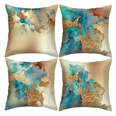 four decorative pillows with blue, gold and white designs on the front one is square