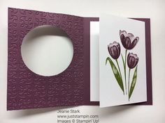 an open card with some flowers on it