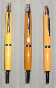 four different types of pens lined up in a row on top of eachother