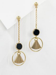 These earrings are inspired by the geometric patterns characteristic of the Art Deco era. Polished, semi precious black agate stone feature at the centre, contrasting with the surrounding warm, golden brass.  The bold lines and symmetry of the design are simultaneously classic and contemporary.  Held by a solid brass stud with stainless steel earring post.  Approximate measurements- 6.5cms long 2cms wide  ✨All Set Theory jewellery comes with care instructions and a polishing pad to keep your jewels looking shiny and fabulous! Modern Gold Earrings With Black Enamel, Modern Gold Onyx Earrings, Gold Minimalist Earrings With Black Enamel, Black Geometric Jewelry, Minimalist Black Brass Jewelry, Set Theory, Gold Art Deco Earrings, Black Dangle Earrings, Black Agate Stone