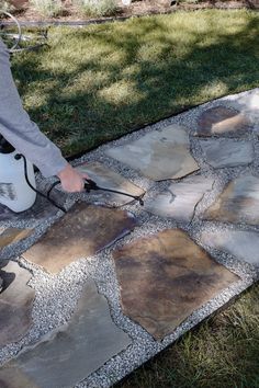 Foxglove flagstone path to our front porch. How to lay a flagstone walkway. Blue, orange, and tan flagstone path inspiration. Organic and whimsical path to house. How to install flagstone path with limestone chips or gravel. How to glue pea gravel path so it doesn't scatter. How to glue rocks between flagstone so they stay in place. Landscape and hardscape exterior design. Flagstone path tutorial by Nadine Stay | #flagstonepath #flagstonewalkway #diy #exteriordesign How To Lay Flagstone, Rubber Walkway, Flagstone Pathway, Flagstone Pavers, Patio Edging