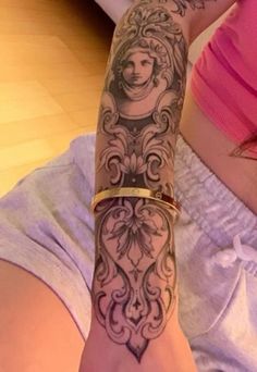 a woman with a tattoo on her arm