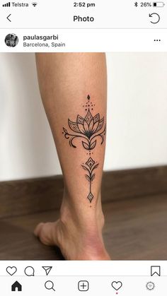 a woman's leg with a flower tattoo on it