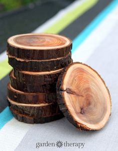 several pieces of wood stacked on top of each other in front of a table cloth