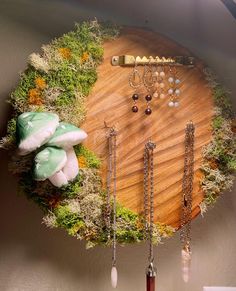 a wooden table topped with lots of jewelry