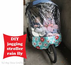 a baby stroller with stuffed animals in it and the words diy jogging stroller rain fly