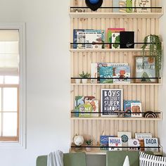 a living room filled with furniture and bookshelves