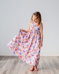 "Our girls sundress features a beautiful butterfly print on a soft pink background, a scoop neck, an elastic back waist and adjustable strappy neck tie.  Shown in a maxi length, our dress is also available in a midi or tea length.  The full skirt makes for fun twirling at birthday parties, family events, wedding receptions, church functions and other special events! Matching doll dresses can be added to your dress purchase by using the following listing:  https://www.etsy.com/listing/1598406363/ Pink Sleeveless Dress With Butterfly Print, Girls Midi Dress, Fond Rose Pale, Floral Meadow, Birthday Summer, Girls Sundress, Modesty Fashion, Soft Floral, Doll Dresses