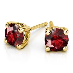 A glistening pair of romantic round cut ruby stud earrings in gold. Each red gemstone measures 3.2 mm, with an approximate 1/3 carat total weight, and held in a yellow gold four-prong setting. Proudly made in the USA. Piercing Inspiration, Blue Sapphire Studs, Paris Jewelry, Ruby Earrings Studs, Sapphire Earrings Studs, Sapphire Studs, Versatile Jewelry, Gemstone Stud Earrings, Women Earrings