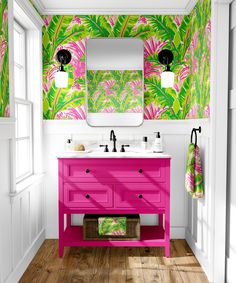 a bathroom with pink vanity and green wallpaper on the walls, along with two sinks