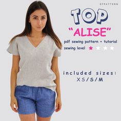 a woman wearing shorts and a top with the words, top alise on it