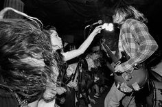 two black and white photos of people playing guitar in front of a microphone while another person sings