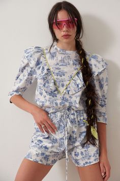 Our Joni top is back this season in beautiful blue Toile de Jouy. This season we added bold chartreuse piping and grosgrain ribbon to really make it pop. The leg-o-mutton puff sleeves are lined with tulle for maximum volume.  - 100% Cotton - Slips on over head and ties in a bow at the back neck - Fits true to size - Ma Brown Toile, Leg Of Mutton Sleeve, Little House On The Prairie, Blue Toile, Cotton Slip, Boutique Tops, High Waisted Trousers, Sustainable Clothing, Grosgrain Ribbon