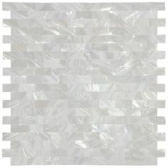 a white tile wall that looks like it has been made out of plastic and is lined with