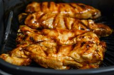 chicken wings cooking in an air fryer