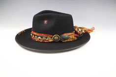 The Babylon Fedora Take yourself to hat heaven with The Babylon. The perfect name for this stunning fedora. Featuring a vintage paisley silk fabric band as the base for this hat. Over the top we have used a faux  suede band that features a lucious concho with a gold filagree design. The feathers used for this hat are a mixture of Rooster and Pheasant. Features tiger eye and black onyx stones. *Please note these are all handmade and that may result in some subtle differences to the hat you receive, we believe this is a good thing as it ensures our hats are always unique* Hat Colour: Black This hat is available in 4 sizes. - Small - 55cm. Height 9-10cm approx - Medium - 57cm. Height 9-10cm approx - Large - 59cm. Height 10-11cm approx - Extra Large 61cm Height 10-11cm approx (Please note this Vintage Fedora For Festival, Vintage Fitted Fedora For Festival, Fitted Vintage Fedora For Festival, Vintage Flat Brim Fedora For Festivals, Vintage Brimmed Fedora For Festivals, Vintage Felt Hat With Short Brim For Festivals, Festival Top Hat With Short Brim, Vintage Fedora Hat For Festivals, Vintage Top Hat With Short Brim For Festivals