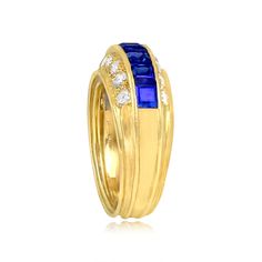 A vintage cocktail ring featuring a row of carré cut sapphires. The total approximate weight of the sapphires is 0.80 carats. Accenting the sapphires are horizontal rows of pave-set round brilliant cut diamonds that are set above and below. The total approximate weight of the diamonds is 0.96 carats. This ring is handcrafted in 18k yellow gold, circa 1970’s.


The width of this ring is approximately 5.01 mm.
This ring is currently sized at 5.5 and can be resized to any finger size at no extra co Luxury Yellow Gold Sapphire Ring Channel Set, Classic Multi-stone Sapphire Ring With Baguette Cut, Formal Multi-stone Baguette Cut Sapphire Ring, Formal Baguette Cut Multi-stone Sapphire Ring, Baguette Cut Multi-stone Sapphire Ring For Formal Occasions, Baguette Cut Multi-stone Sapphire Ring For Formal Events, Formal Yellow Gold Channel Set Sapphire Ring, Luxury Sapphire Ring With Baguette Diamonds, Timeless Multi-stone Sapphire Ring For Formal Occasions