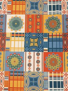 an orange, blue and yellow patchwork pattern with flowers on the center is shown