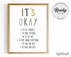 it's okay to be yourself print in a wooden frame on a white wall