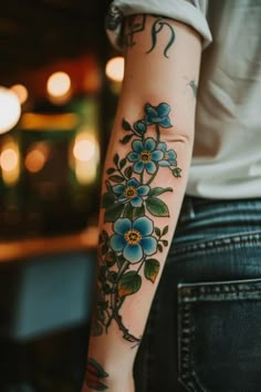 a person with a flower tattoo on their arm