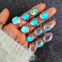 "Bulk Aura Quartz Rings, Wholesale Gemstone Rings, Bulk Aura Quartz Rings, 925 Silver Plated Rings, Wholesale Jewelry, Women Rings, Size 5-11 Gemstone: Aura Quartz Size: 5 to 11 (US Sizes) Metal: Brass  Polish: Best Quality Silver Plating Polish Type & Style: Boho and Hippie,  Statement Rings  GIFT: A Awesome Gift for Your Mother, Daughter, Sister & Every Family Members and Relatives, Friends. Every Person can Wear This Gorgeous HandCrafted Rings.Beautiful Ring for Womens and Mens Too.  PRIDEMYLOOK SHIPPING Policy:- FREE AND FAST SHIPPING STORE FINE HANDCRAFTED AND FASHION JEWELRY  AT REASONABLE PRICES HANDMADE 925 STERLING SILVER SPINNER RINGS HANDMADE STONES LIKE THE FAMOUS \"PRIDEMYLOOK\" NATURAL STONES FOR EXAMPLE MOONSTONE LABRADORITE JASPERS AGATES SEMI PRECIOUS STONES OPALS QUARTZ L Magical Adjustable Silver Crystal Ring, Adjustable Silver Magical Style Rings, Handmade Magical Silver Rings, Handmade Magical Silver Crystal Ring, Celestial Silver Crystal Ring, Celestial Style Silver Crystal Ring, Iridescent Gemstone Jewelry With Magical Style, Celestial Silver Rings For Jewelry Making, Mystical Silver Opal Ring