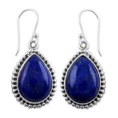 pair of earrings with blue lapis and silver beads on white background, front view