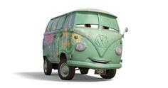 a green vw bus with graffiti on it's side