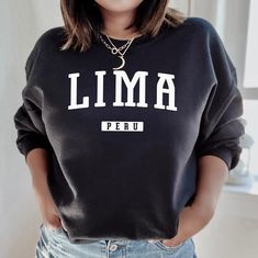 Show your love for Lima with this design that features Lima Peru in a classic style.  GILDAN 18000 CREWNECK SWEATSHIRT  * Super comfortable unisex heavy blend crewneck sweatshirt  * 50% cotton, 50% polyester  * Pre-shrunk  * Classic fit that runs true to size  * 1x1 athletic rib knit collar with spandex  * Air-jet spun yarn with a soft feel and reduced pilling  * Double-needle stitched collar, shoulders, armholes, cuffs and hem      SWEATSHIRT SIZING IN INCHES  S = 20" Width x 27" Length x 33.5" Casual Crew Sweatshirt With Name Print, Casual Crew Neck Sweater With Name Print, Casual Long Sleeve Sweatshirt With Name Print, Lima Travel, Lima Peru, Limassol, Peru, San Jose, Tumble Dryer