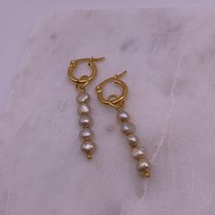 Materials: Stainless steel gold-plated hoop earrings, fresh water pearls. Sizing + Fit: This earring is meant to hug the earlobe. 12mm hoops. Fresh Water Pearls, Pearl Hoop Earrings, Water Pearls, Infinity Bracelet, Handcrafted Jewelry, Fresh Water, Freshwater Pearls, Gold Jewelry, Hoop Earrings