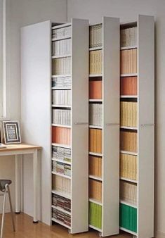 a room with some bookshelves in it