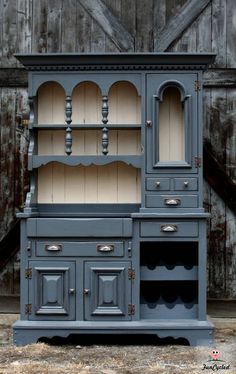 an old fashioned china cabinet painted blue