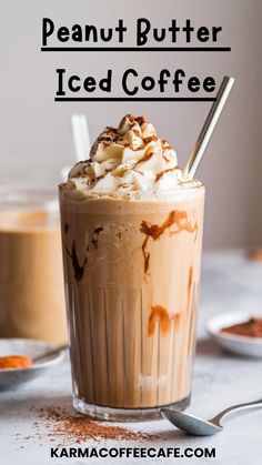 a glass filled with ice coffee and topped with whipped cream