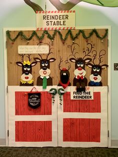 the door to reindeer stable is decorated with christmas decorations