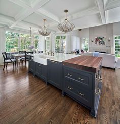 a large kitchen with an island in the middle