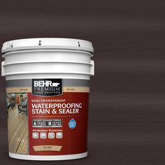 a bucket of waterproofing stain and sealer sitting on top of a wooden floor