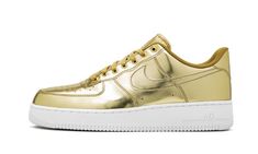 The Women’s Nike Air Force 1 �“Metallic Gold” is the iconic low-top sneaker in a flashy and luxurious colorway.  Releasing as part of Nike’s “Liquid Metal” collection of Air Force 1 Lows, the look features a premium, shiny gold leather finish applied to the entire upper.  A tonal outlined Swoosh covers the mid-panel, while the heel features classic Nike Air detailing in a darker hue.  Tonal laces and a mini “AF1” emblem on the throat of the shoe are complimented by a white midsole with Air brandi Womens Air Force 1, Metallic Gold Shoes, Gold Nike, Nike Snkrs, Tenis Nike, Nike Gold, Liquid Metal, Nike Air Force 1 Low, Gold Shoes