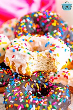 there are many donuts with different colored sprinkles