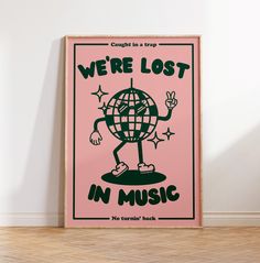 there is a poster on the wall that says, we're lost in music