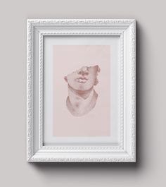 a white frame with a drawing of a bear in it's head on the wall