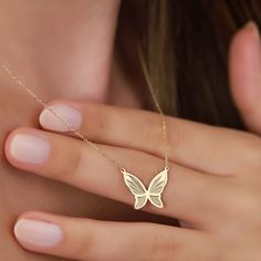 "Meet our elegant 14K Gold Butterfly Necklace, a dazzling piece that effortlessly combines elegance and nature-inspired beauty. This gold butterfly necklace is crafted with precision and attention to detail, making it the perfect accessory for those who value both style and sophistication. PRODUCT ∙ FEATURES: * Material: 14K solid gold provides lasting quality and shine. * Stunning Gold Options: Choose from Yellow gold for a classic touch, Rose gold for a hint of romance, or White gold for timel Luxury Gold Butterfly Necklace Fine Jewelry, Luxury Yellow Gold Elegant Butterfly Necklace, Delicate Yellow Gold Butterfly Charm Necklace, Delicate White Gold Butterfly Jewelry, Delicate Butterfly White Gold Jewelry, Fine Jewelry Butterfly Necklace For Anniversary, Butterfly Shaped Fine Jewelry Necklace For Anniversary, Elegant 14k Gold Necklace With Butterfly Charm, Elegant Butterfly Jewelry As A Gift For Her