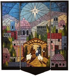 three panels with stained glass depicting the birth of jesus and baby jesus in a manger scene