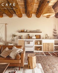 a living room filled with furniture and wooden beams