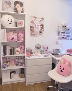 a room with a desk, chair and shelves filled with stuffed animals