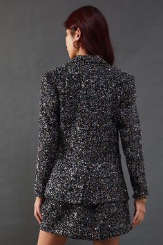 Dazzling sequin-embellished boucle fabric for a luxurious texture
Tailored blazer silhouette with a single-button closure
Notched lapels and long sleeves for a classic look
Versatile design suitable for both formal and casual occasions
Coordinating mini skirt available for a complete ensemble
Make a statement with this eye-catching sequin boucle blazer from Warehouse. The intricate sequin detailing adds a touch of glamour to the classic blazer silhouette, perfect for those who want to stand out from the crowd. Pair it with the matching mini skirt as seen on the model for a coordinated look that's sure to turn heads at your next night out. For a more versatile approach, style it with tailored trousers and a simple camisole for an elevated office-to-evening ensemble. The blazer's structure Lace Skater Dress, Boucle Fabric, Floral Outfit, Classic Blazer, Tailored Blazer, Cold Weather Outfits, Tshirt Skirt, Halterneck Dress, Going Out Dresses